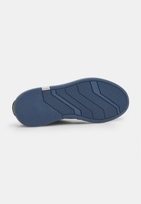 Blue rubber shoe sole with a textured grip pattern, featuring angular shapes and a smooth grey accent near the heel for support.