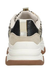 Sneaker featuring a black and beige design, textured materials, including suede and snakeskin accents, and a white and brown sole.
