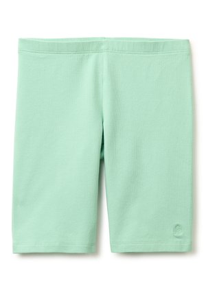 Leggings vert clair mi-genou avec taille élastique et petit logo brodé près de l'ourlet inférieur sur la jambe droite.