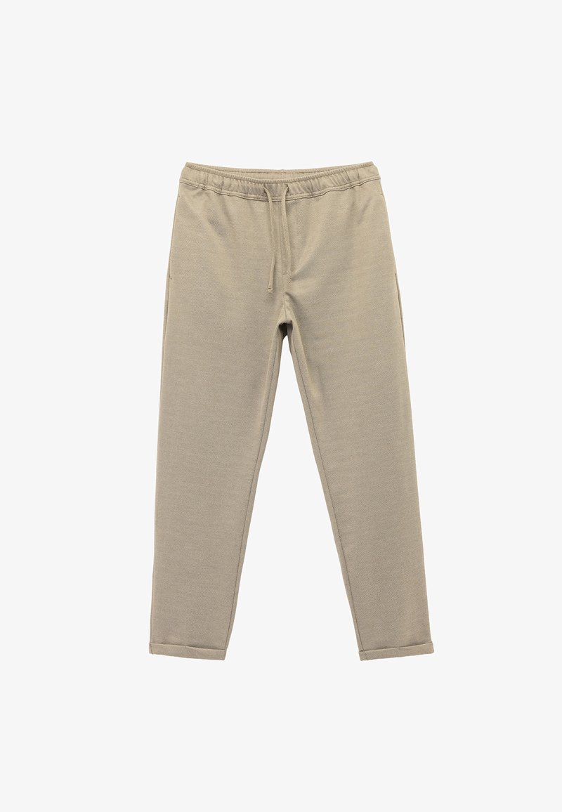 Beige Jogginghosen aus strukturiertem Stoff, mit elastischer Taille, Kordelzug und schmal zulaufendem BeinDesign sowie seitlichen Taschen.