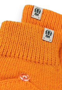 Orange knitted gloves featuring a ribbed design, textured wool material, leather labels with a graphic, and a clear button accent.