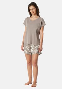 Grey short-sleeve top made from soft fabric, paired with light beige shorts featuring a white abstract pattern. Both are lightweight and relaxed fit.