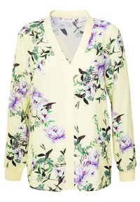 Floral blouse with a yellow background, featuring purple and green floral patterns, long sleeves, V-neck, and soft fabric texture.