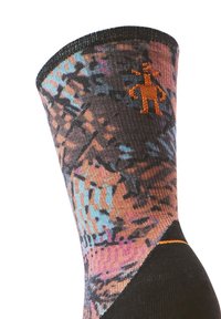 Calza colorata a motivo nero, con design astratti in blu e arancione. Caratteristico logo arancione vicino al risvolto.