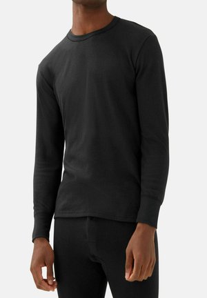 Schwarzes Langarmshirt aus geripptem Material mit Rundhalsausschnitt und taillierter Passform. Weicher Stoff, kombiniert mit passenden Unterteilen in einer einfarbigen dunklen Farbe.