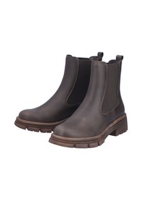 Bottes chelsea en cuir marron avec des panneaux latéraux élastiques, semelle en caoutchouc texturée, et accents de tirette. Talon épais et design à bout rond.