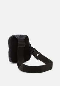 Jordan JAN AIRBORNE HIP UNISEX - Geantă crossbody - black