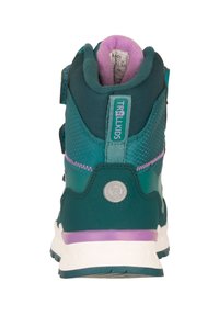 Zapatillas altas para niños en tonos verde azulado y púrpura con tejido texturizado, correas de velcro y tirador de marca en la parte trasera.