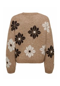 Suéter grueso en color beige con una textura suave, que presenta grandes patrones florales en blanco y negro, puños acanalados y un corte relajado.