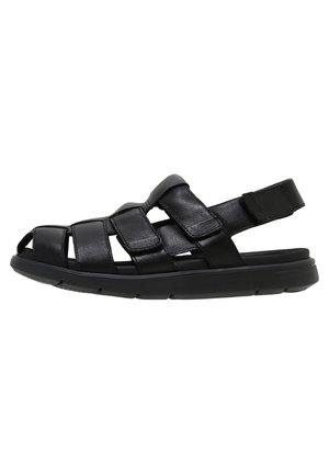 Schwarze Herrensandale aus Leder mit verstellbaren Riemen und gepolsterter Sohle, entworfen für Komfort und Atmungsaktivität.