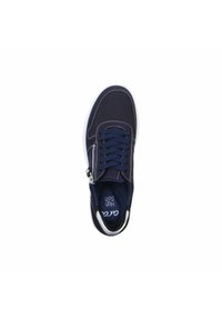 Navy blue sneaker with perforated leather, white stitching, and a side zipper. Features a cushioned interior and contrasting sole.
