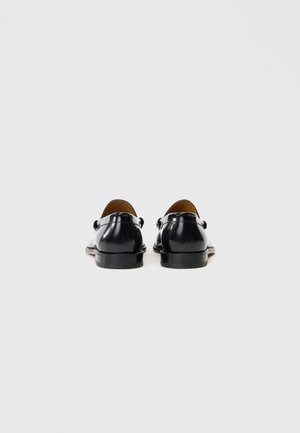 Rank 15: Vivienne Westwood - COIN - Slip-ons