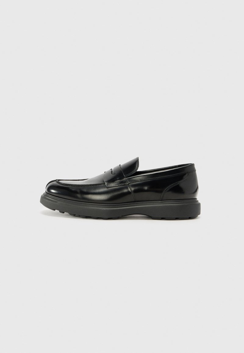 Black leather loafer with a glossy finish, rounded toe, subtle stitching details, and a thick rubber sole for durability.