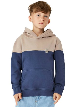 Hættebluse i beige og navy. Har en kænguru-lomme, ribbede manchetter og et stofmærke-logo på brystet. Blødt, tekstureret materiale.