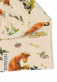 Puuvillapipo, jossa on vaalea beige tausta ja värikkäitä eläinten, kirjojen ja kasvien kuvastoja. Mukana sivutunniste.