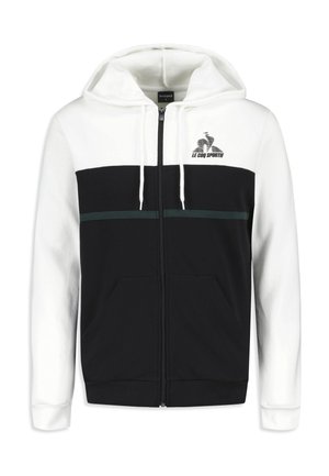 Zip-up hooded sweatshirt in black and white. Features a solid black lower body, contrasting white upper, green accent stripe, and kangaroo pockets.