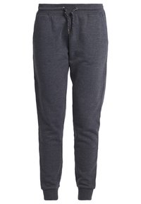Grå sweatpants i mjukt bomullsblandning, med elastisk midja och dragsko, smalnande ben och ribbad mudd.