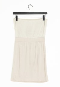 Beige strapless mekko mustalla naulakolla. Korostaa istuvaa vartalo-osaa, jossa on kerrostettu vyötärö ja hulmuava helma. Suuri sileä pinta kauttaaltaan.