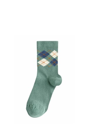 Zöld pamutzokni bordázott textúrával és kék, fehér, valamint narancssárga argyle mintával. Erősített toe rész a tartósság érdekében.
