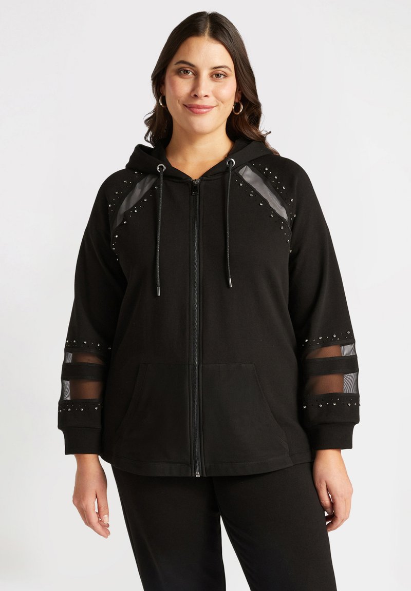 Svart zip-up hoodie i mjukt tyg, med meshpaneler, nitar på axlarna och ärmarna, samt en framficka.