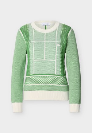 Zeleni i bijeli pleteni džemper dugih rukava s teksturiranim geometrijskim uzorcima i rebrastim manšetama i rubom, Lacoste logo na prsima.