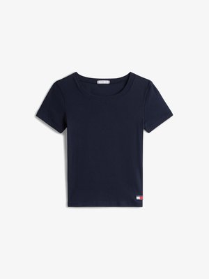 Navy blue short-sleeve ribbed crop top with round neckline and small Tommy Hilfiger logo tag on bottom hem.