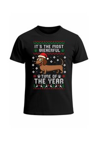 Black t-shirt featuring a cartoon dachshund wearing a red Santa hat, with festive text and patterned details in red, green, and white.