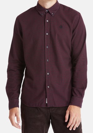 Kariertes Hemd aus burgunderroter und marineblauer Baumwolle. Button-Down-Kragen, lange Ärmel, Frontknöpfe und ein gesticktes Logo auf der Brust.