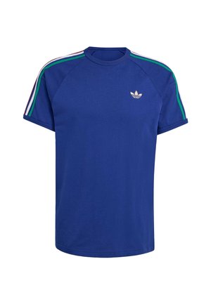 Modré bavlněné tričko s raglánovými rukávy, s třemi pruhy v zelené, bílé a červené barvě podél ramen a malým zlatým logem na hrudi.