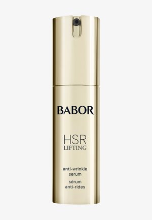 Guldcylindrisk flaska med svart text, märkt "BABOR HSR LIFTING anti-rynkserum." Slät yta, pumpdispenser på toppen.
