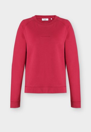 Red long-sleeve crewneck sweatshirt with subtle front logo embroidery and ribbed cuffs and hem, displayed on a light background.