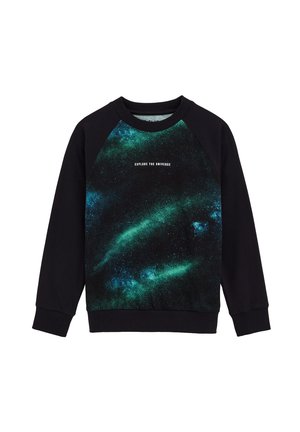 Sweatshirt noir avec de longues manches raglan, présentant un imprimé galaxie coloré en vert et bleu sur le devant. Le texte indique "EXPLOREZ L'UNIVERS."