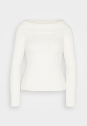 Balta off-the-shoulder megztinis su ilgomis rankovėmis, su raukšlėtu tekstūru ir prigludusia siluetu. Minkšta, jauki medžiaga be matomų raštų ar akcentų.