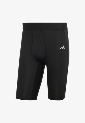 Czarne sportowe szorty wykonane z elastycznego materiału, z dopasowanym krojem, elastycznym pasem i małym białym logo po lewej stronie.