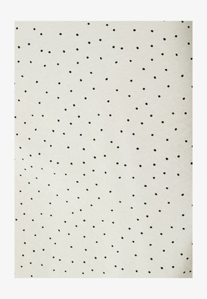 White fabric with an irregular pattern of small, unevenly spaced black polka dots.