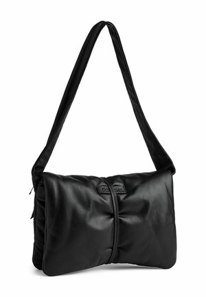 Black leather shoulder bag with a soft, padded design, featuring a wide strap and subtle logo detail on the front. Smooth texture.