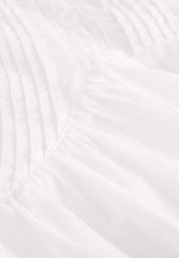 REGULAR FIT  - Áčková sukně - white