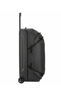 Black wheeled duffle bag with a hard shell design, fabric sections, adjustable straps, and an extendable handle on one side.