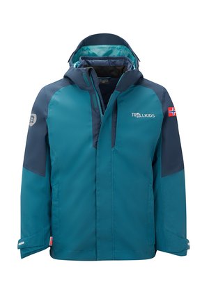 Child's teal and navy waterproof jacket with hood, front zipper, Trollkids logo on chest, and Norwegian flag patches on sleeve and hem.