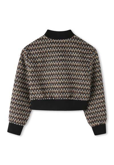 Cropped jacket featuring a zigzag pattern in black, brown, and white, with long sleeves and a black ribbed collar and hem.