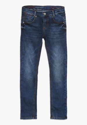 Jean skinny bleu foncé avec poches avant, fermeture éclair, bouton et légère décoloration sur les cuisses et les genoux.