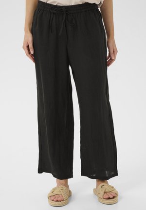 Pantalons noirs, amples, fabriqués en tissu léger avec une taille élastique et un cordon de serrage réglable. Présente un design à jambes droites.