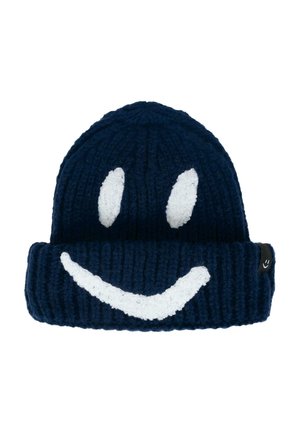 Béret tricoté bleu marine avec texture côtelée, présentant un design de visage souriant blanc et une étiquette de logo sur le côté. Matériau en acrylique doux.