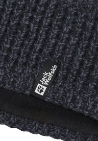 Knit beanie in dark gray with a textured pattern. Features a black fabric label with white brand logo. Soft, cozy inner lining.