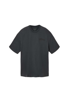 Black oversized short-sleeve t-shirt with crew neck and subtle embroidered text on the left chest.