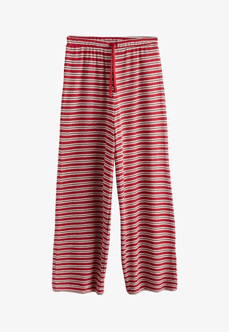 Pantalon en maille rayé horizontal rouge et blanc avec jambes larges et cordon rouge à la taille élastique, sur fond blanc.