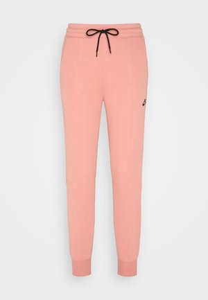 Roze Nike sweatpants met een zwarte trekkoord, ribgebreide enkelboorden, zijzakken en een klein zwart Nike-logo op het linker bovenbeen.