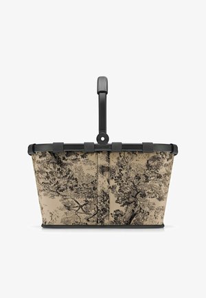 Mand met een beige stoffen lichaam met een zwart boompatroon, zwart plastic frame en een stevige handgreep om te dragen.