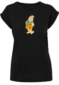 Black short-sleeve t-shirt featuring a cartoon character in an orange outfit with black spots and a blue scarf, graphic printed on the front.