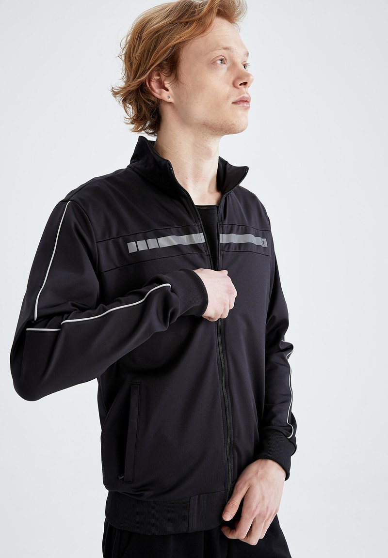 Herren Trainingsanzüge | DeFacto SLIM FIT Trainingsjacke black/schwarz - ZZ61071 Herren Trainingsanzüge | DeFacto SLIM FIT Trainingsjacke black/schwarz - ZZ61071